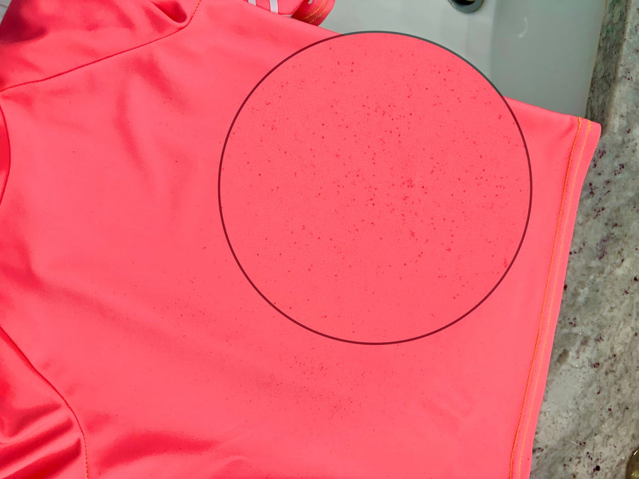 Black spots on swimsuit