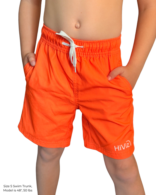 Child wearing hi-vis neon orange swim trunks with a white drawstring, side pockets, and white HiViz logo.