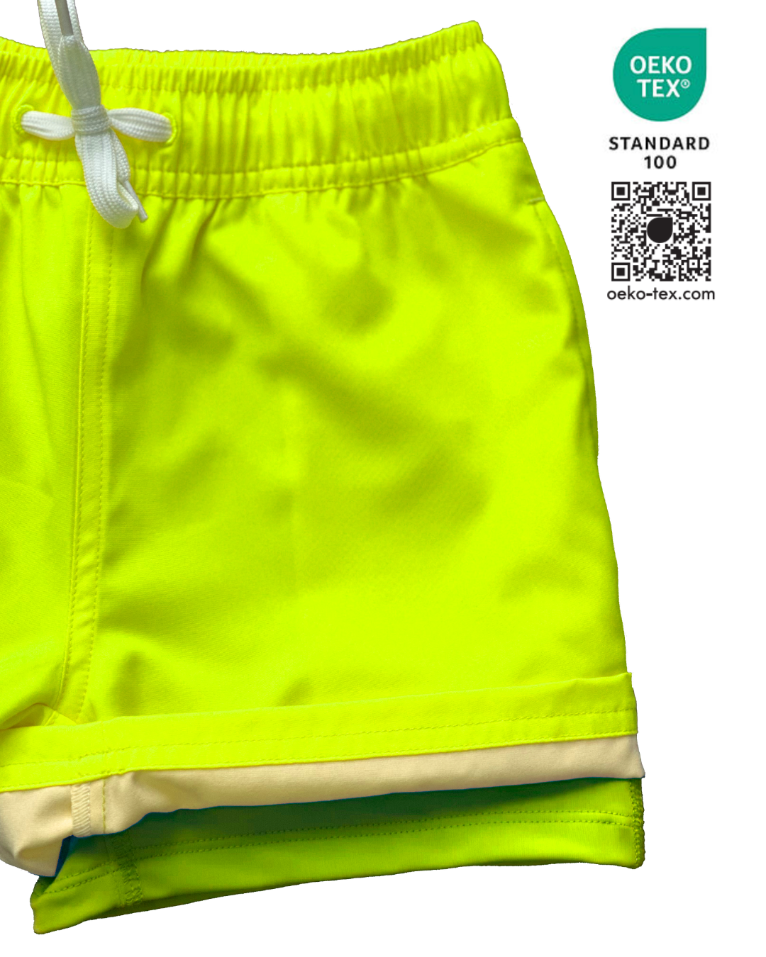 Boys bright neon yellow swim shorts with neon yellow boxer brief liner for anti-chaff comfort, quick drying,  with a functional drawstring and a full waist elastic band and reinforced pockets. The boys neon yellow bright swim trunks stand out against any background. 