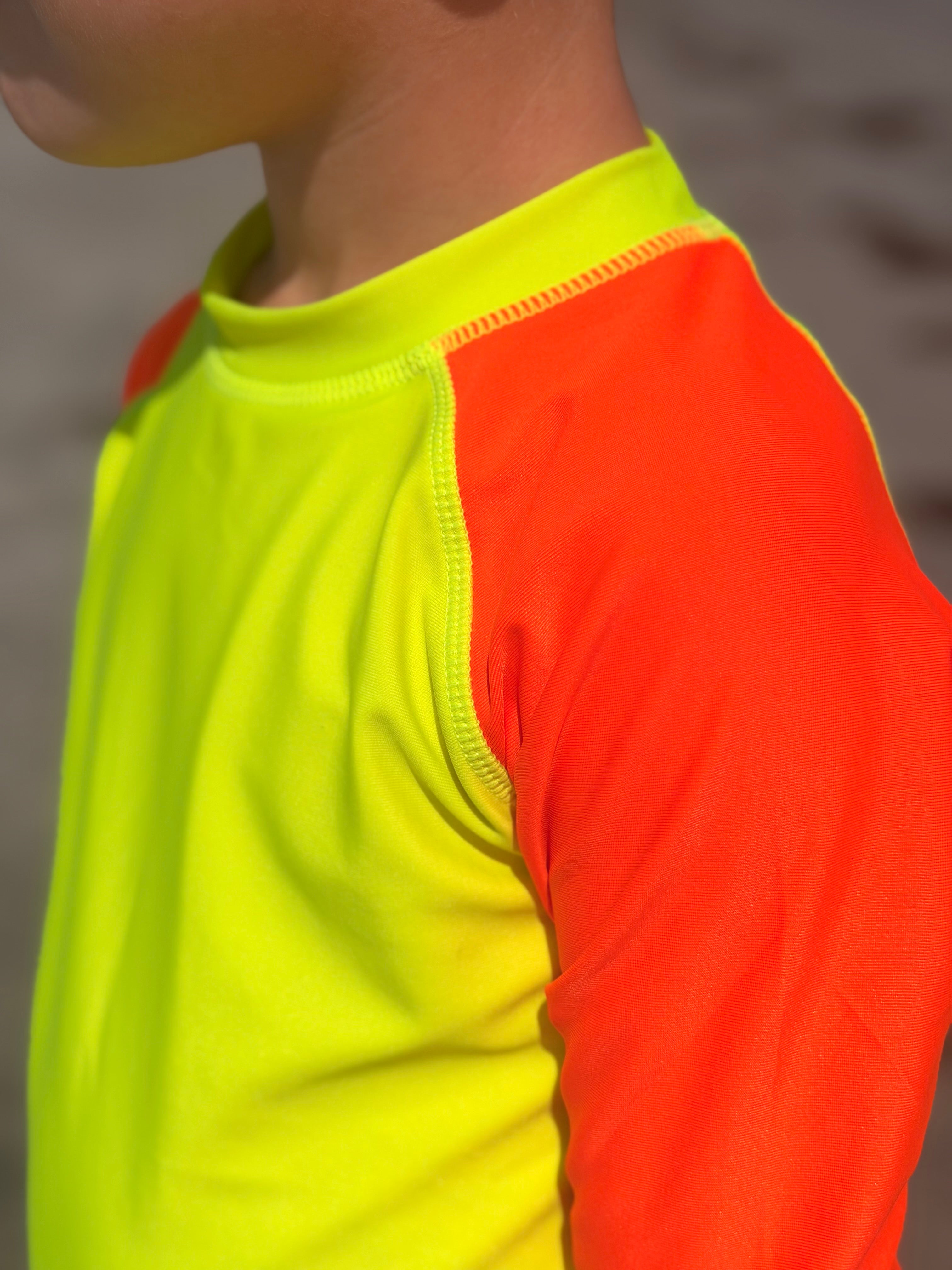 Product image of bright swimwear rash guard neon yellow body neon orange rash guard sleeves.
