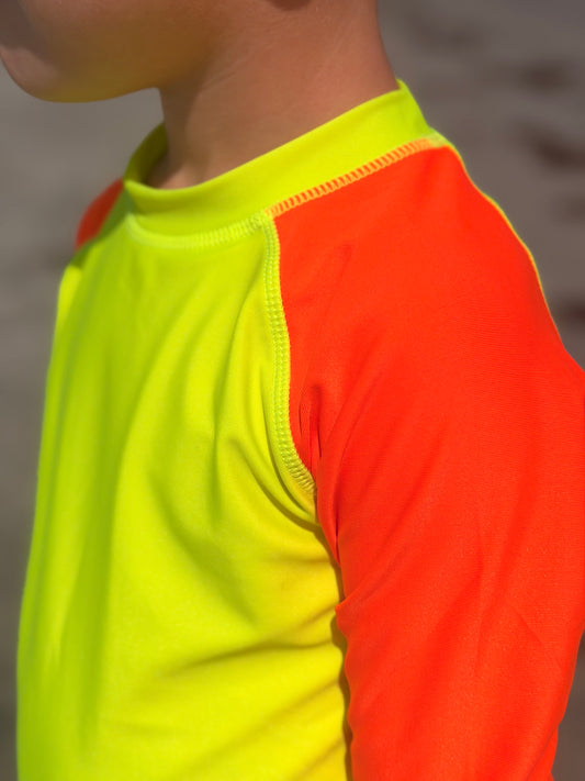 Product image of bright swimwear rash guard neon yellow body neon orange rash guard sleeves.