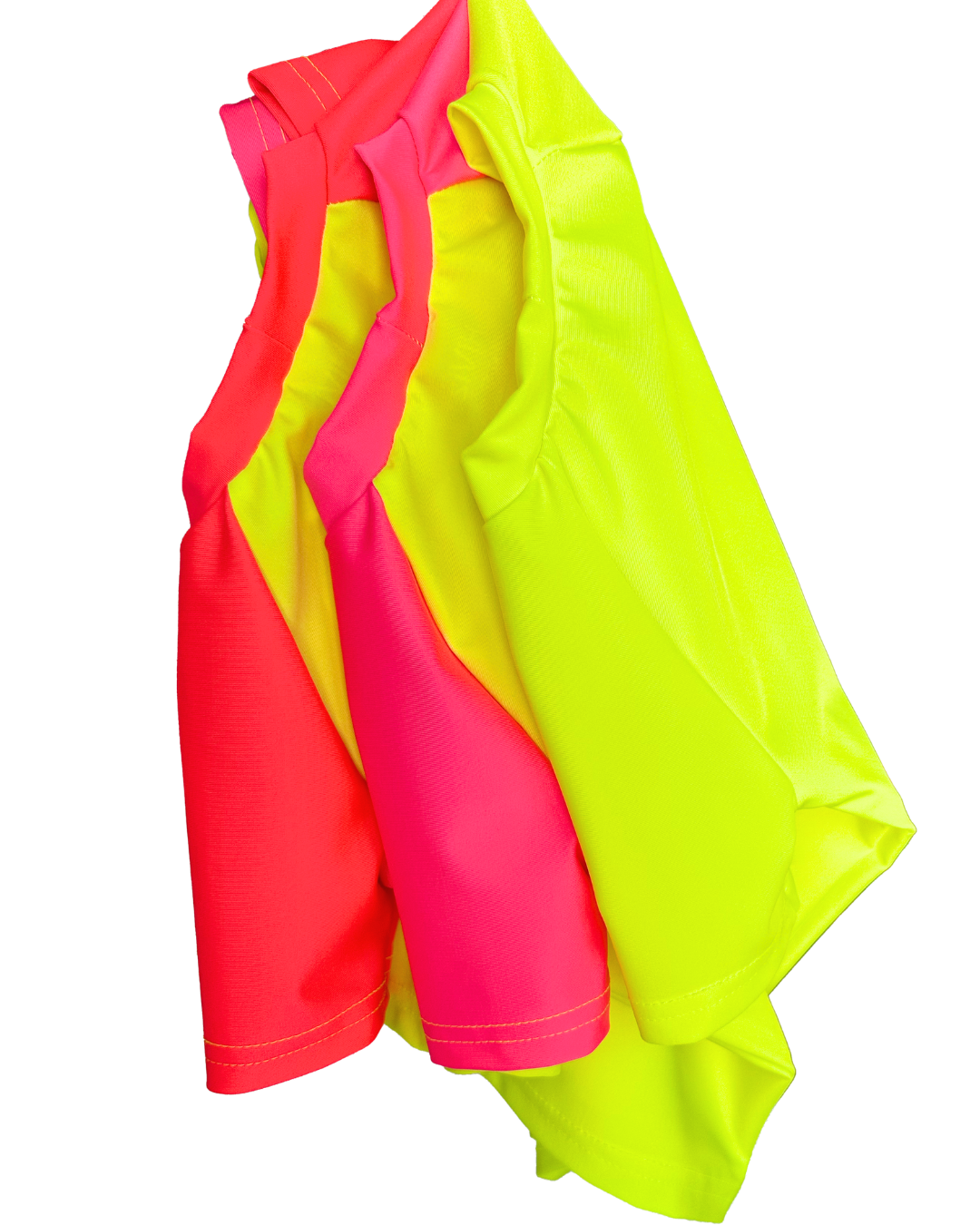 Three bright swimsuit neon rash guards hang from their sleeve. Bright neon yellow short sleeve rash guard on the right, bright neon yellow and neon pink short sleeve rash guard in the middle and bright neon yellow and neon red short sleeved rash guard on the right. These bold bright swimsuits will help your children stand out in and around water and provide the highest 50+ UPF sun protection. 