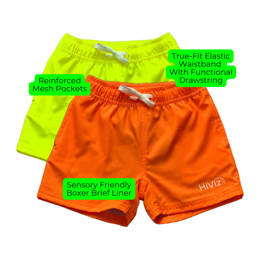 The boys neon yellow bright swim trunks stand out against any background. 