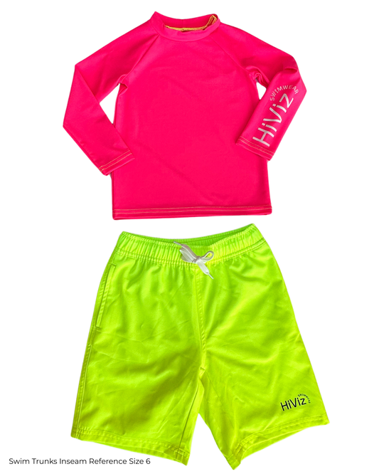 Pink long-sleeve rash guard and green swim trunks with 'HIVI' branding on a white background.