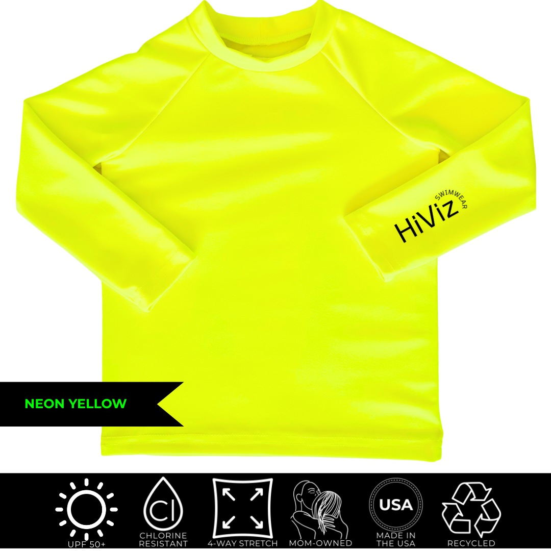 Bright swimwear for toddlers, this is a product image of a toddler neon yellow rash guard with HiViz bright swimwear logo on the left sleeve. 
