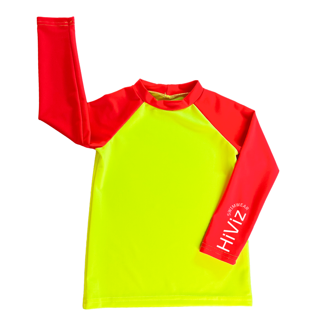 Product image of a kids rash guard boys rash guard neon yellow with neon orange sleeves.
