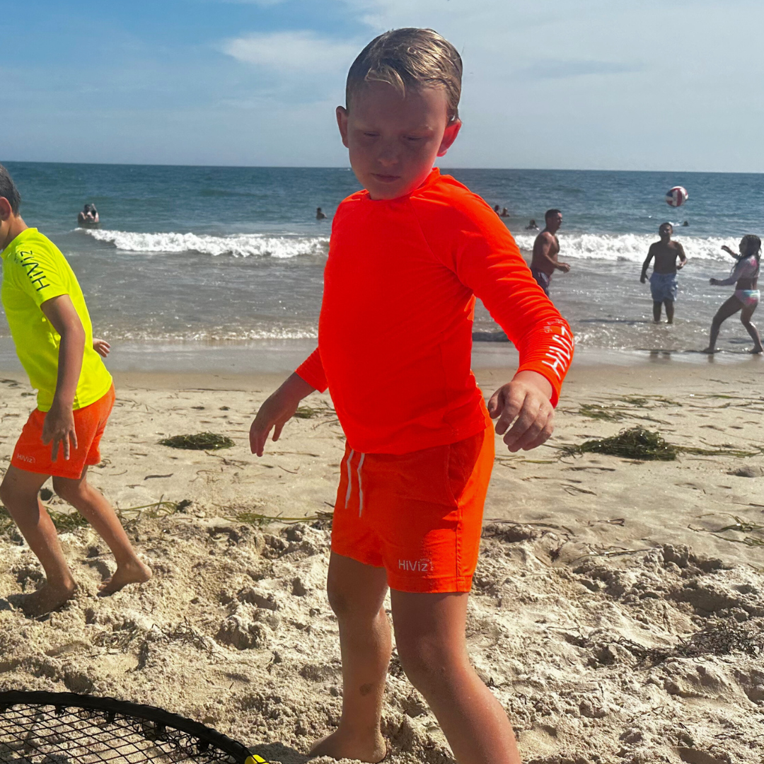 Bright Swimwear Kids' Neon Rash Guard in Neon Orange UPF 50+