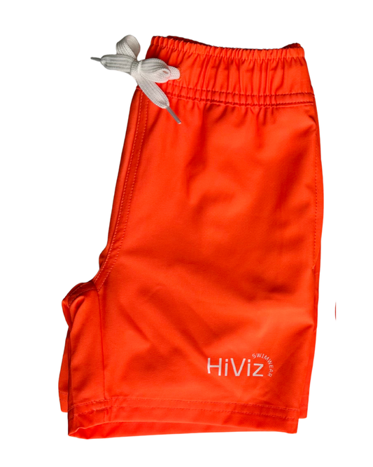 A side leg view of hiviz neon swim trunks for boys in neon orange.